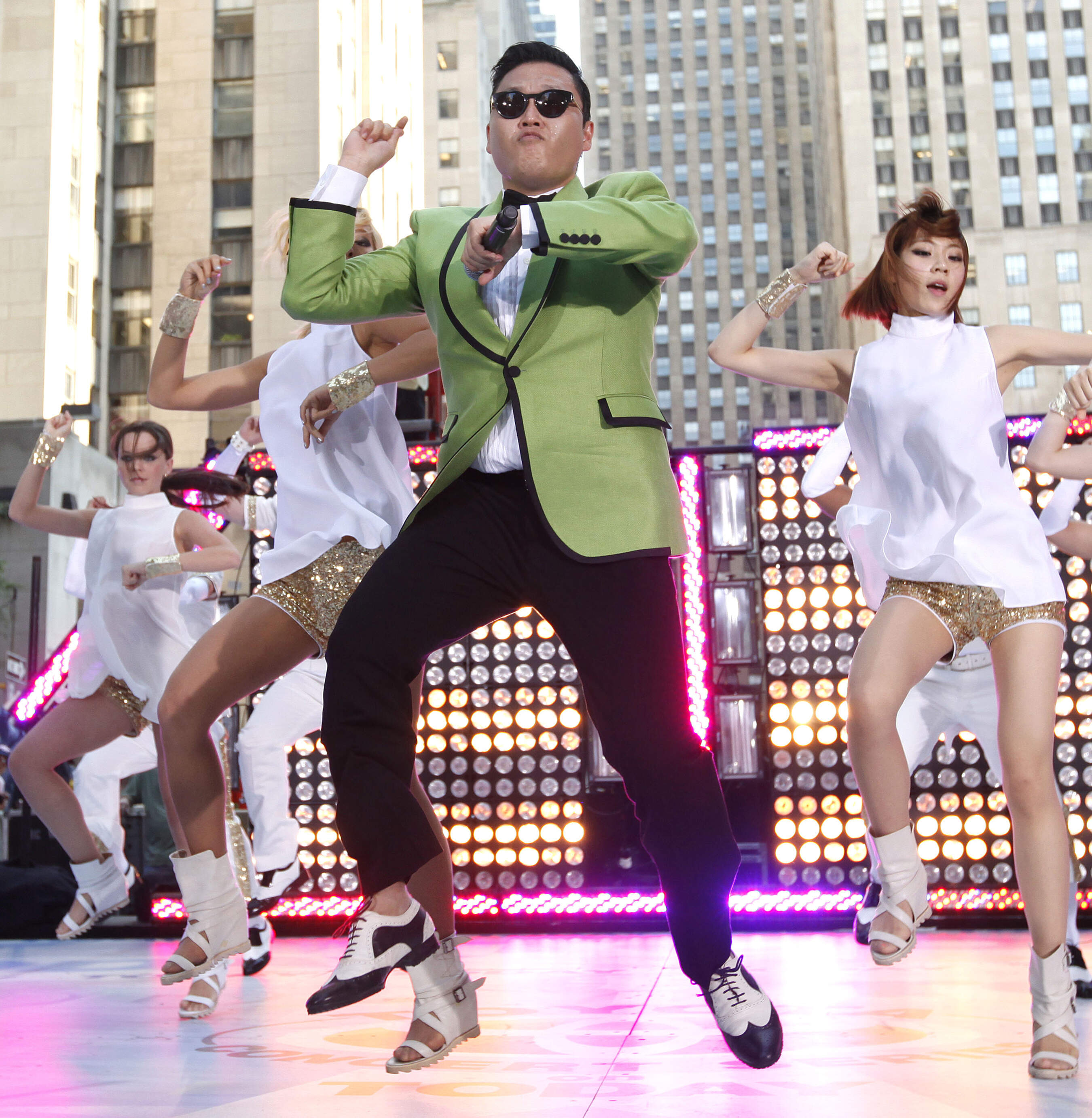 Psy performs "Gangnam Style" in 2012. The jacket he wore in the song's music video is on display in the exhibition. (Courtesy Jason Decrow, Invision, AP, Shutterstock/Museum of Fine Arts, Boston)
