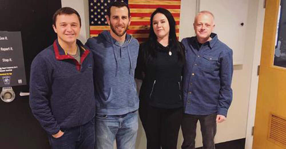 Maegan Ball, second right, stands with, from left, Officer Aaron Bates, Officer Alexander Stotik, and Detective Lt. Gregory Lennon in Cohasset, on Dec. 27, 2019. The three officers had confronted Erich Stelzer while he was stabbing Ball, his date, so viciously that the walls were red with blood. While the officers were relieved to have saved her life, they also wrestled with the ramifications of killing Stelzer despite doing their best to avoid it. (Cohasset Police Department via AP)