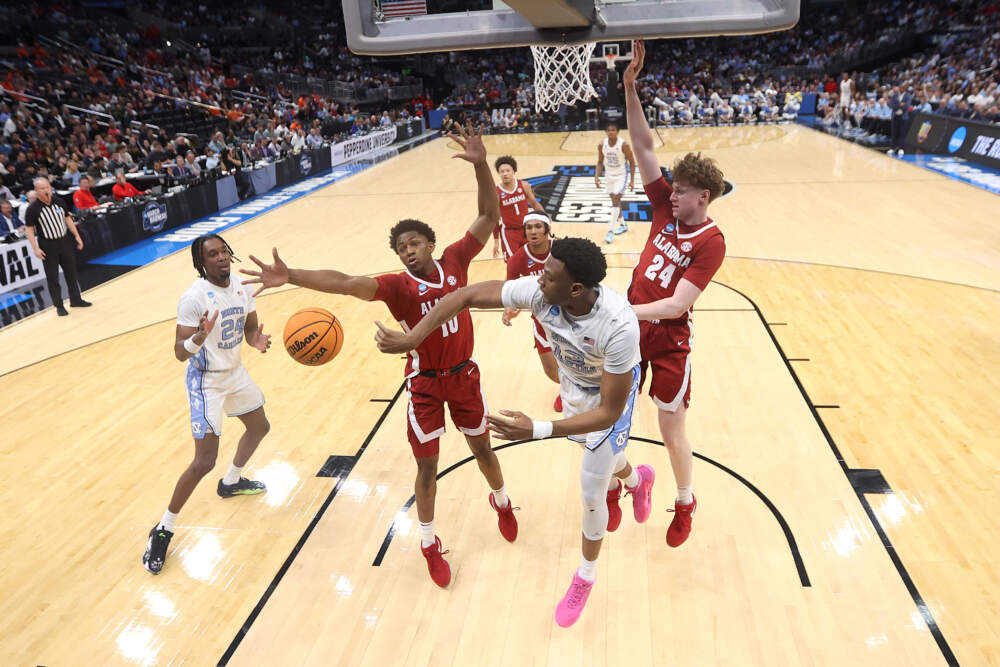 Jalen Washington #13 of the North Carolina Tar Heels passes against Mouhamed Dioubate #10 of the Alabama Crimson Tide Tide during the second half in the Sweet 16 round of the NCAA Men's Basketball Tournament at Crypto.com Arena on March 28, 2024 in Los Angeles, California. The Alabama Crimson Tide won, 89-87. (Ronald Martinez/Getty Images)