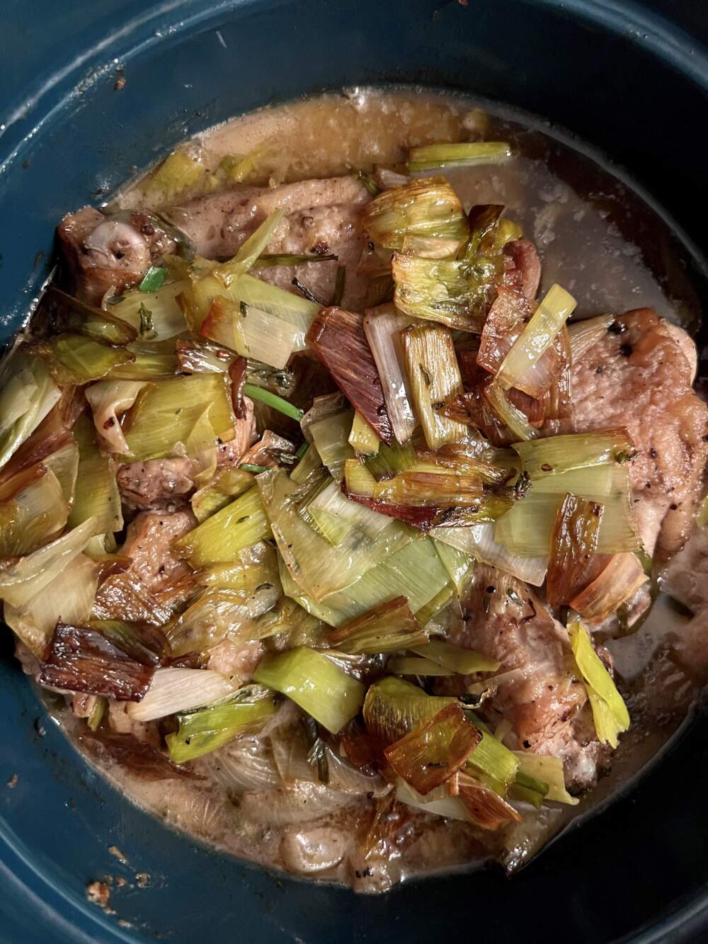 Six onion braised chicken with chives. (Kathy Gunst/Here & Now)