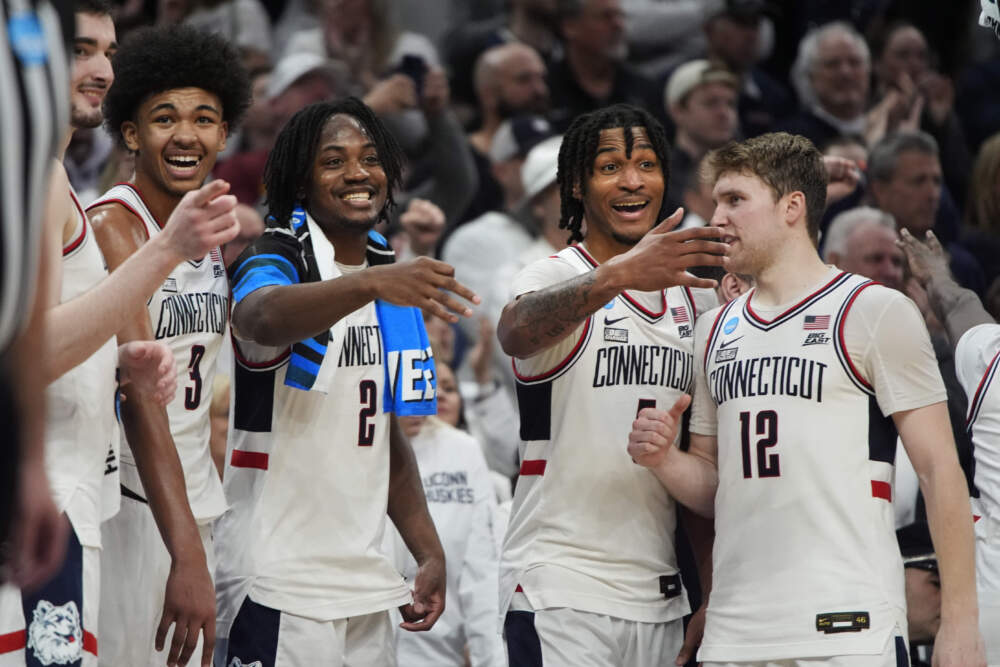 UConn players celebrate shortly before defeating San Diego State in Boston. (Michael Dwyer/AP)