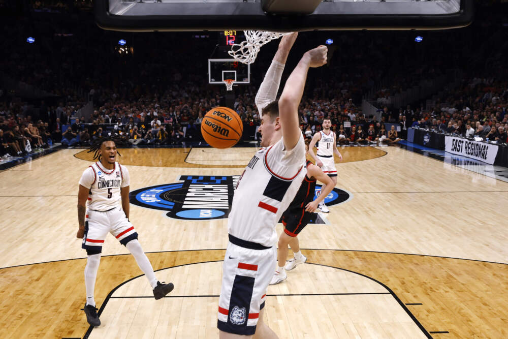 UConn center Donovan Clingan, center, slams a dunk against San Diego State during the second half of the Sweet 16 college basketball game at TD Garden. (Michael Dwyer/AP)