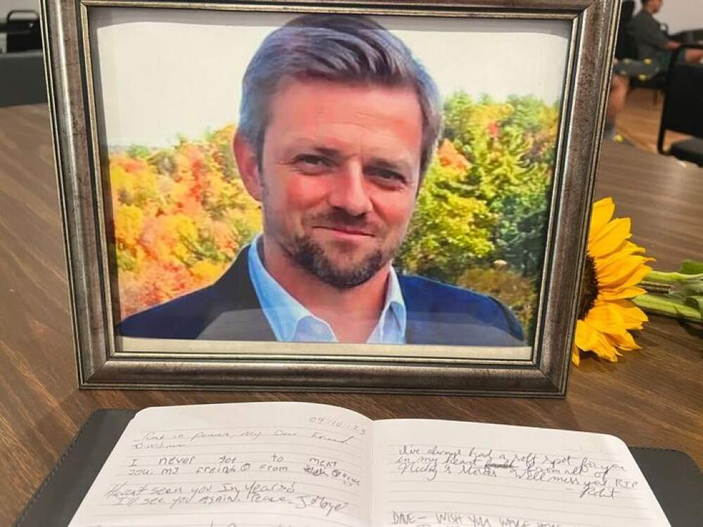 A recent portrait and a guest book at Dave Endris’s celebration of life. (Courtesy Simón Rios)