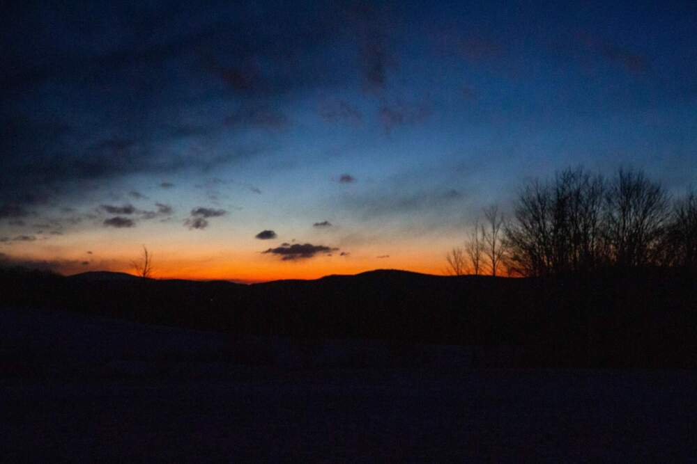 On the afternoon of April 8, 2024, skies will darken over Craftsbury — seen here after sunset on Feb. 29, 2024 — as a total solar eclipse passes over the area. (Elodie Reed/Vermont Public)