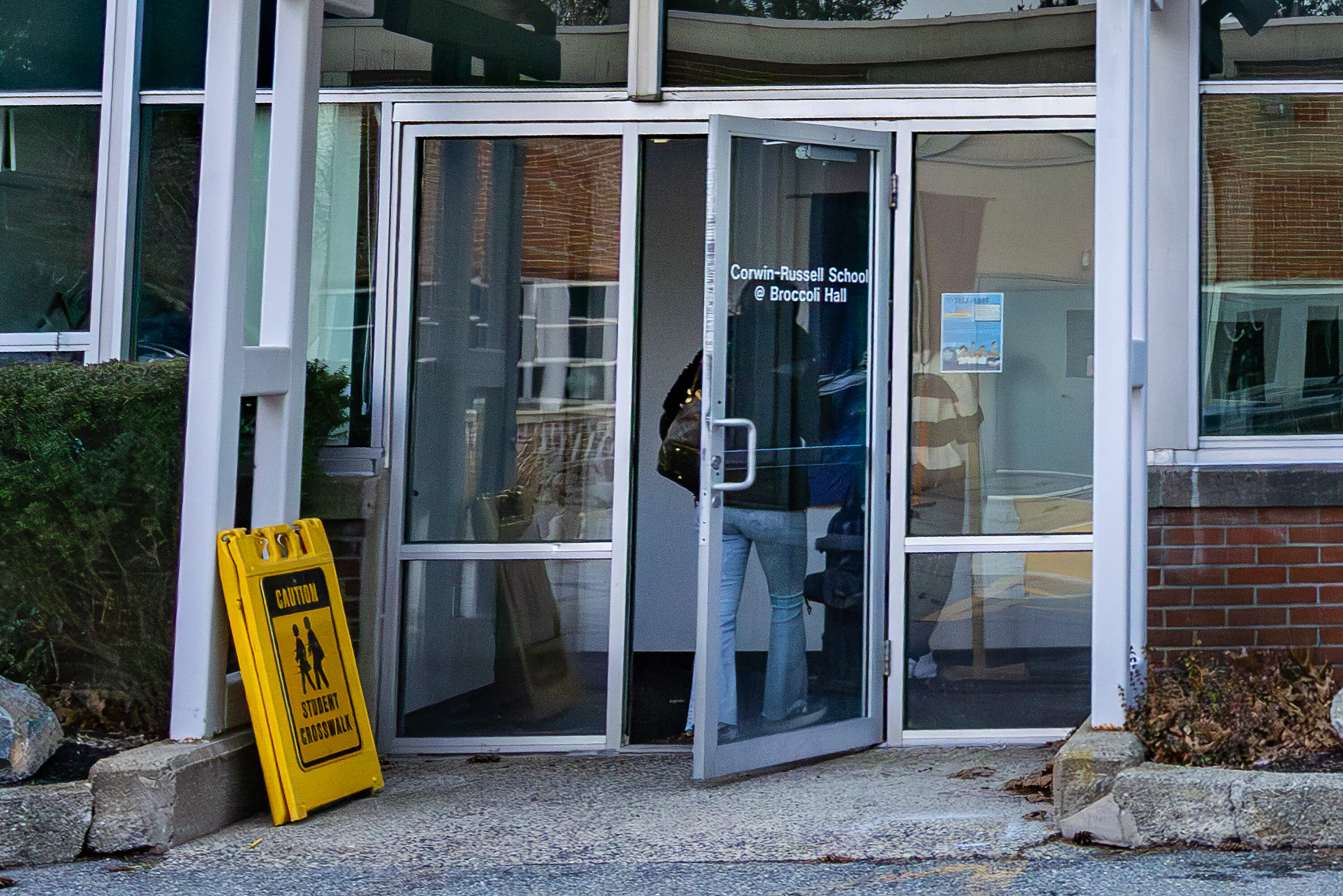Students walk through the entryway of Broccoli Hall in Sudbury. (Jesse Costa/WBUR)