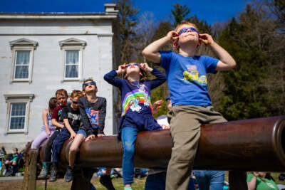 Photos: People watch in wonder as eclipse blots out the sun