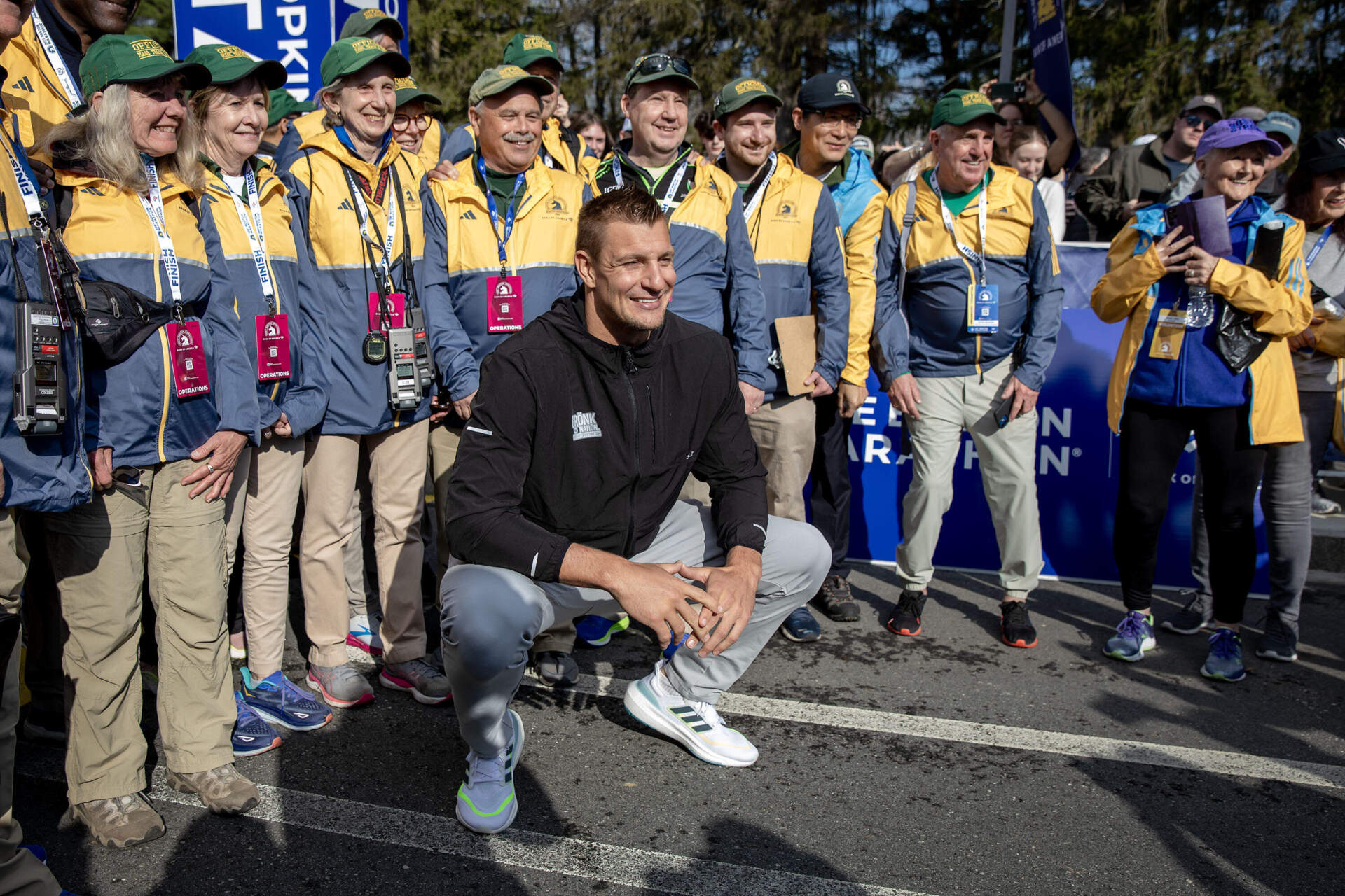 Rob Gronkowski stops for a photo with Boston Marathon start line organizers. (Robin Lubbock/WBUR)