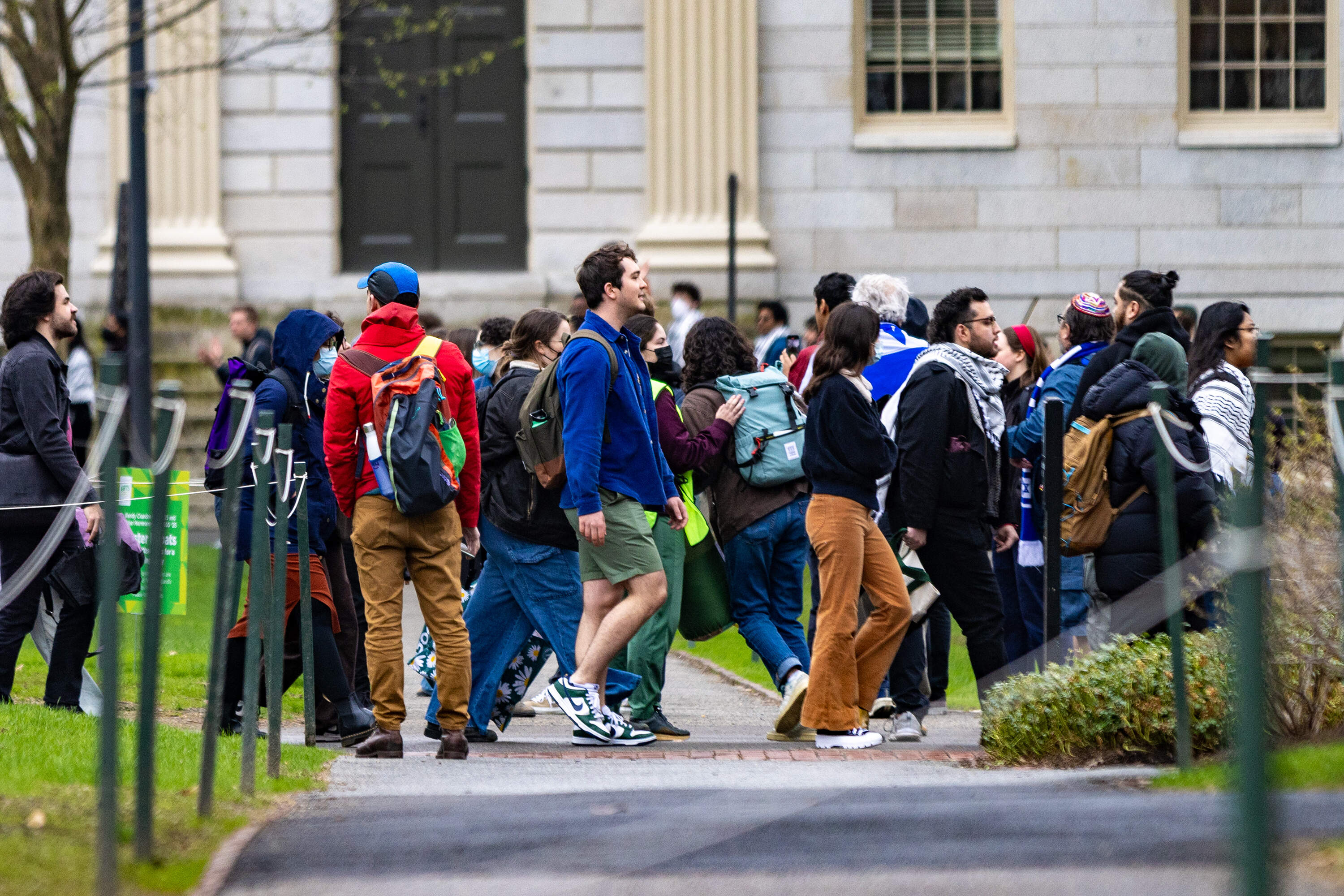 Protesters march around Harvard Yard during a rally in support of the banned pro-Palestine group. (Jesse Costa/WBUR)