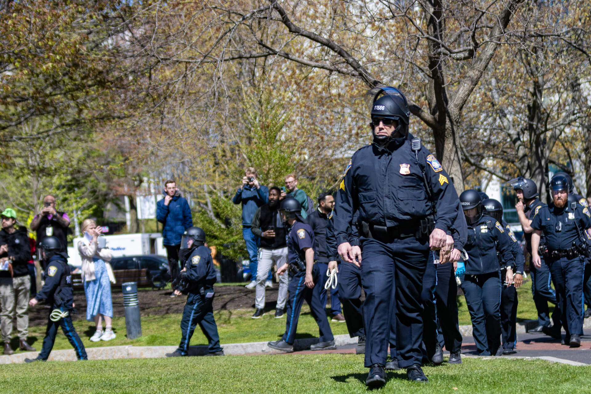 Boston police move toward the encampment at Centennial Common at Northeastern University. (Jesse Costa/WBUR)
