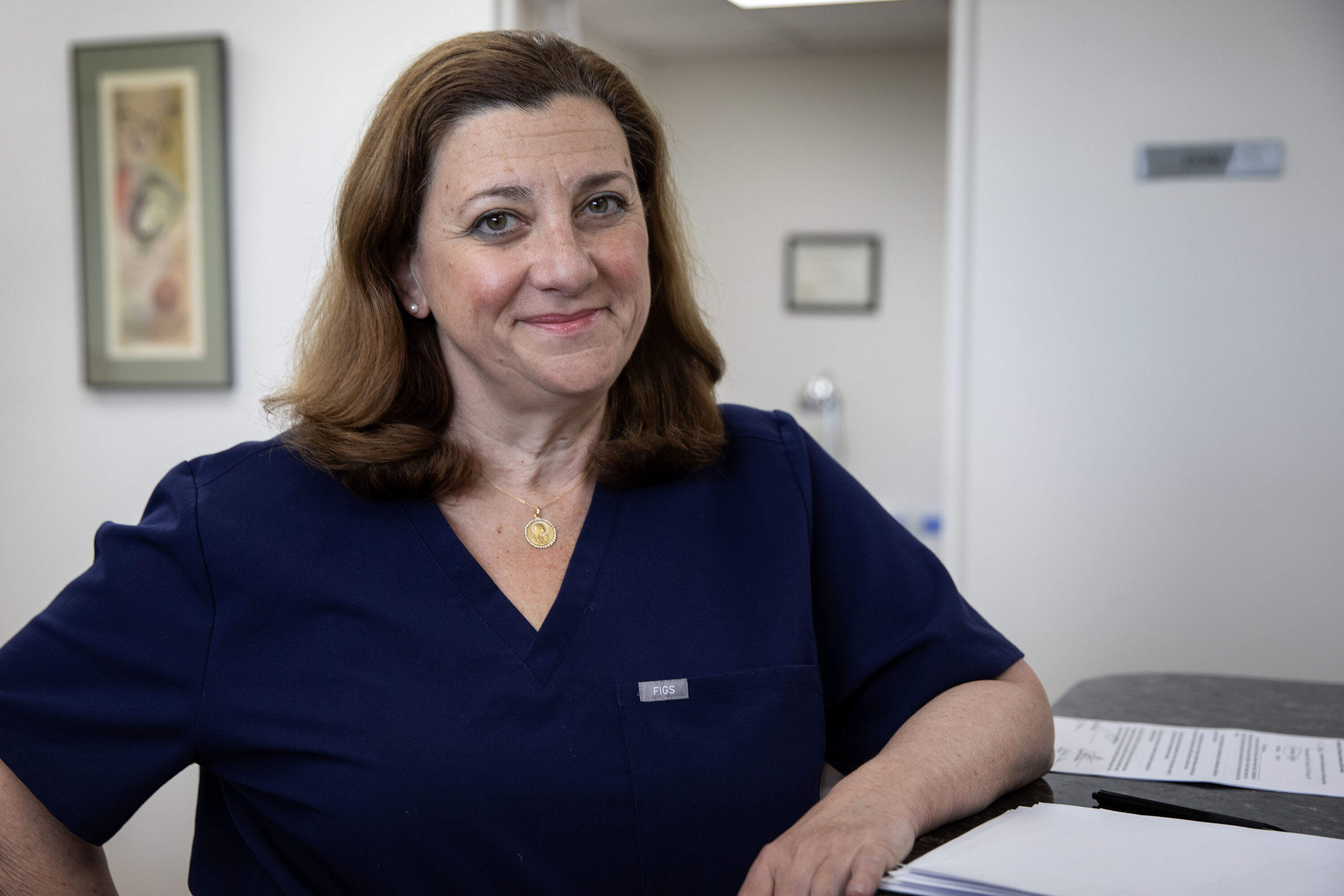 Dr. Paula Muto, at her clinic in North Andover, Mass. (Robin Lubbock/WBUR)