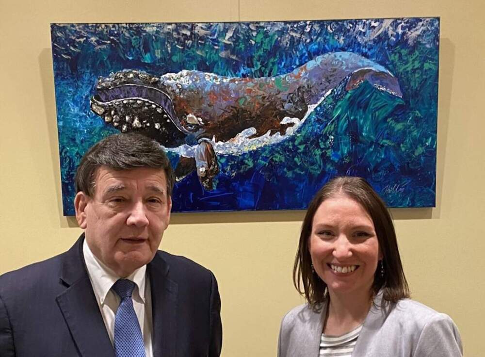 Sen. Marc Pacheco poses with artist Hollis Machala, a Rehoboth constituent, in front of her painting of a right whale, Massachusetts' official state marine mammal. (Sen. Marc Pacheco via SHNS)