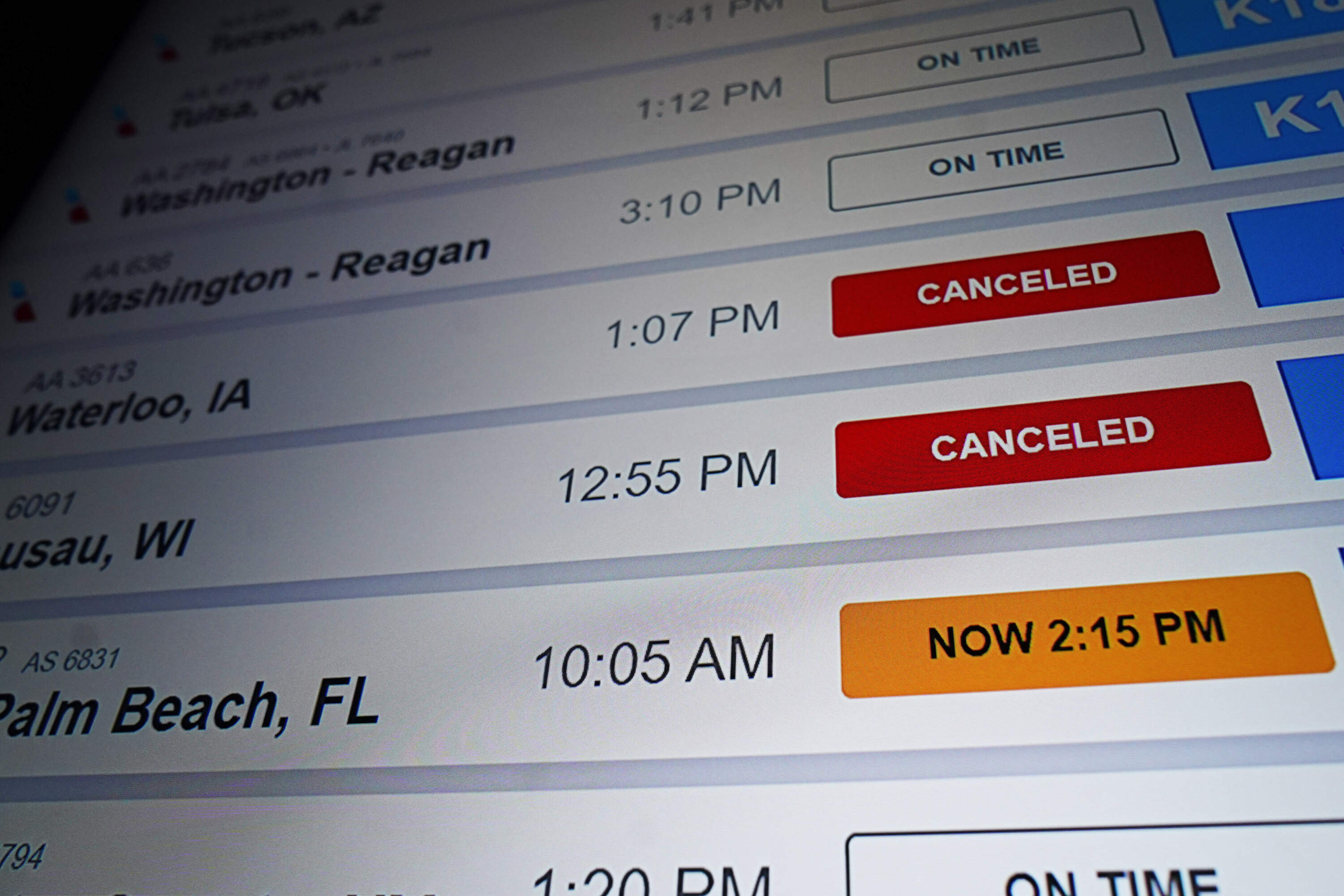 American Airlines flight information screen displays cancelled flights. (Nam Y. Huh/AP)