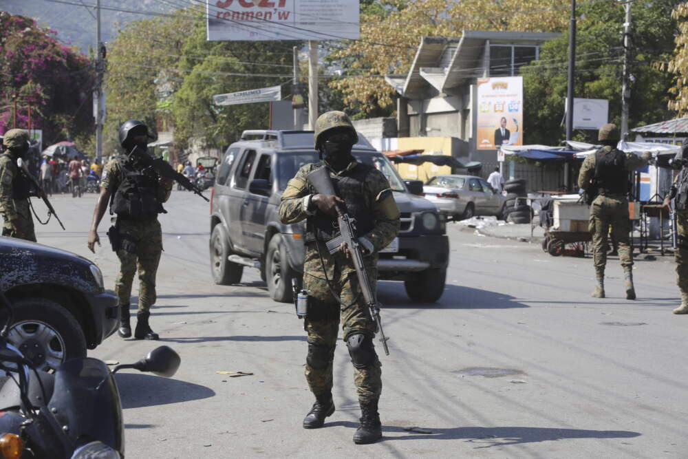 Members of the General Security Unit of the National Palace set up a security perimeter around one of the three downtown stations after police fought off an attack by gangs the day before, in Port-au-Prince, Haiti, on March 9, 2024. (Odelyn Joseph/AP)