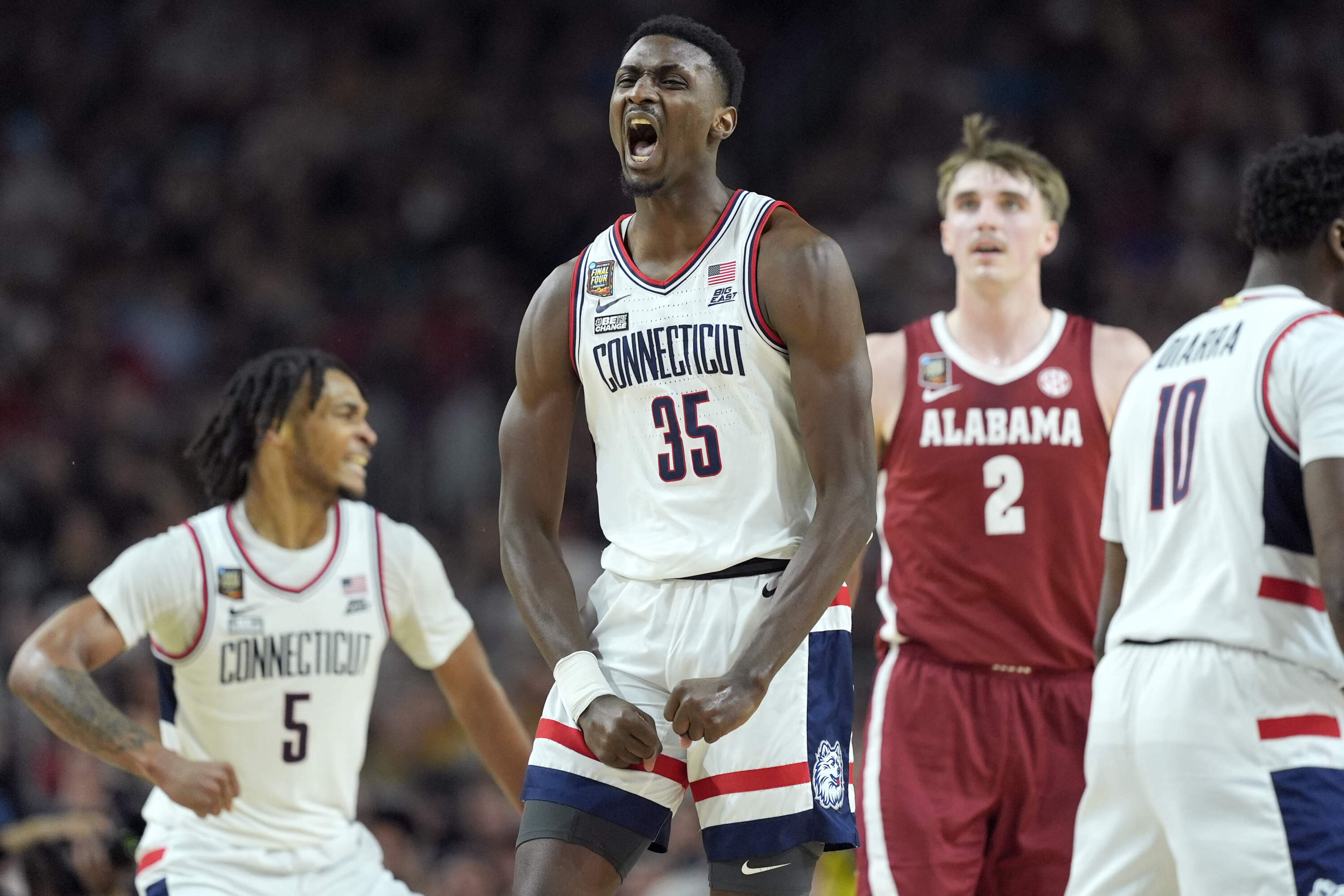 UConn forward Samson Johnson celebrates a basket during the second half of the NCAA college basketball game against Alabama at the Final Four, Saturday, April 6, 2024. (Brynn Anderson/AP)