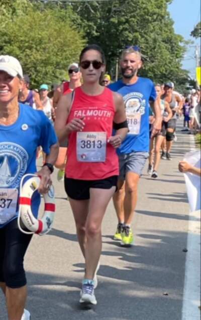 The author running the Falmouth Road Race in 2023 with her husband. (Courtesy Abby Salois)
