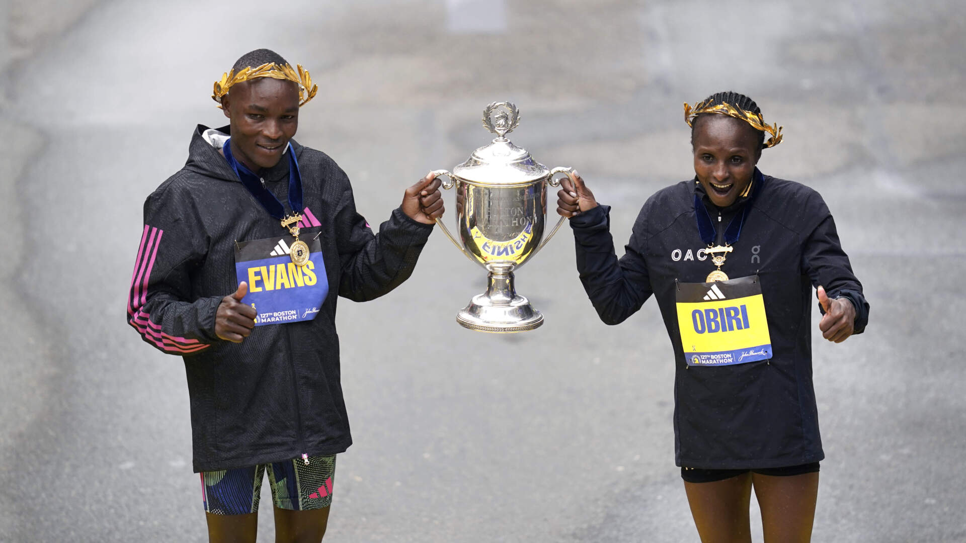 Evans Chebet, left, and Hellen Obiri, both of Kenya, pose on the finish line after winning the men's and women's division of the Boston Marathon, Monday, April 17, 2023. (Charles Krupa/AP)