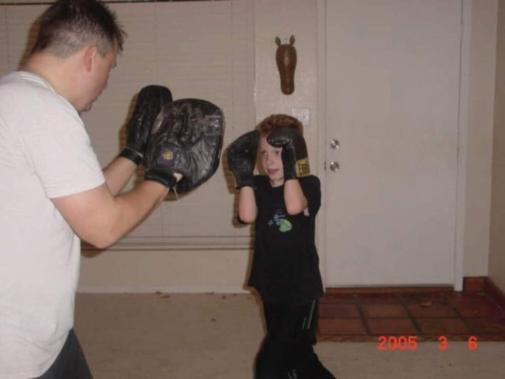 Dakota Adams as a child, training for combat with father, Stewart Rhodes. (Courtesy of Dakota Adams)