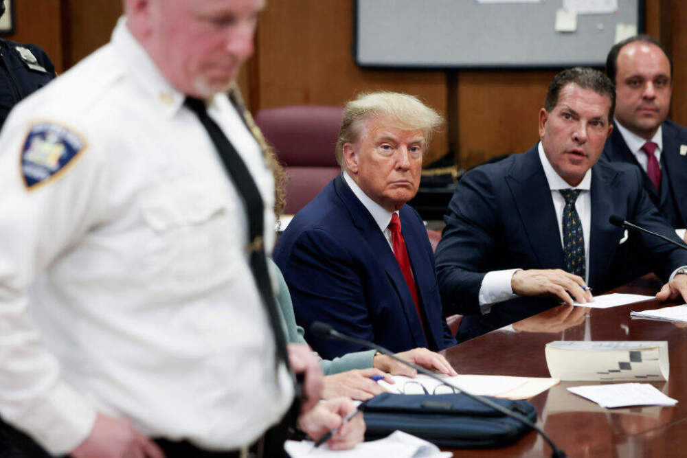 Former U.S. President Donald Trump sits in the courtroom with his attorneys Joe Tacopina and Boris Epshteyn (R) during his arraignment at the Manhattan Criminal Court April 4, 2023 in New York City. (Andrew Kelly-Pool/Getty Images)