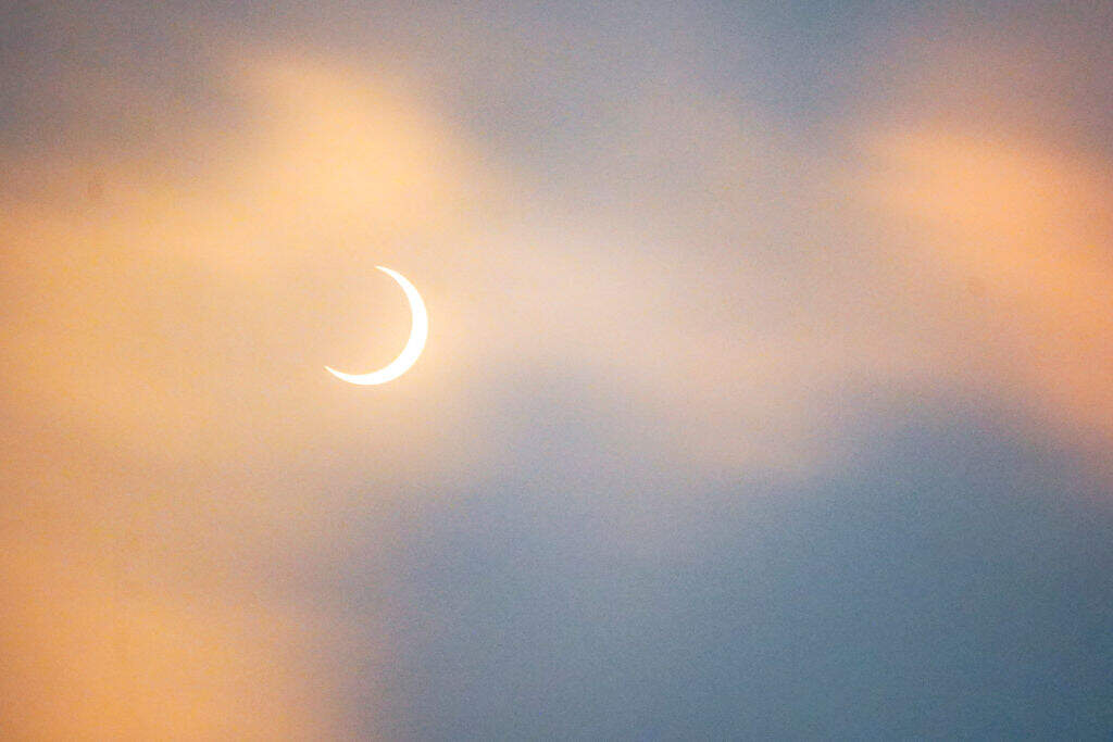 A partial solar eclipse is seen in San Salvador on October 14, 2023. (Photo by Camilo Freedman/ SOPA Images/ LightRocket via Getty Images)