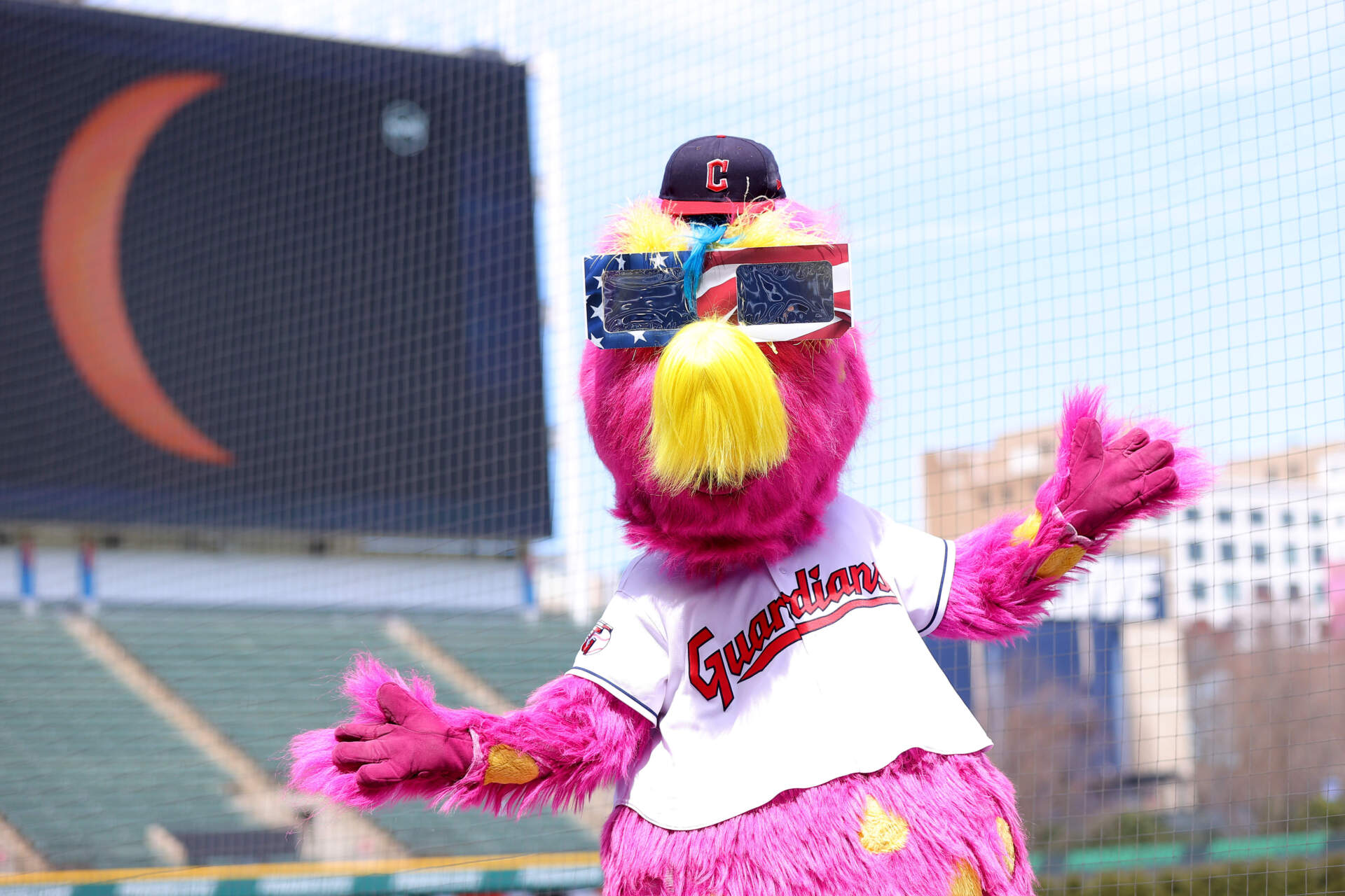 CLEVELAND, OHIO - APRIL 08: Cleveland Guardians mascot Slider poses while wearing eclipse glasses before the home opener against the Chicago White Sox at Progressive Field on April 08, 2024 in Cleveland, Ohio. (Mike Lawrie/Getty Images)
