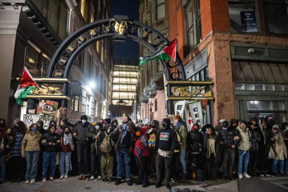 Pro-Palestinian supporters and students from Emerson College block an alley where they have set up an encampment as police move in to clear it. (Joseph Prezioso/AFP via Getty Images)