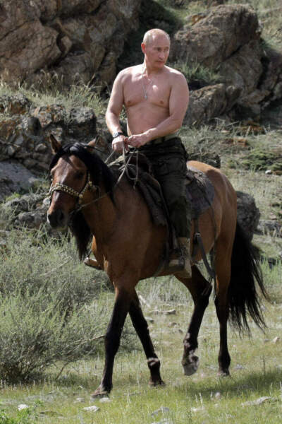 Russian Prime Minister Vladimir Putin rides a horse during his vacation outside the town of Kyzyl in Southern Siberia on August 3, 2009. Alexey Druzhinin/RIA/NOVOSTI/AFP via Getty Images)