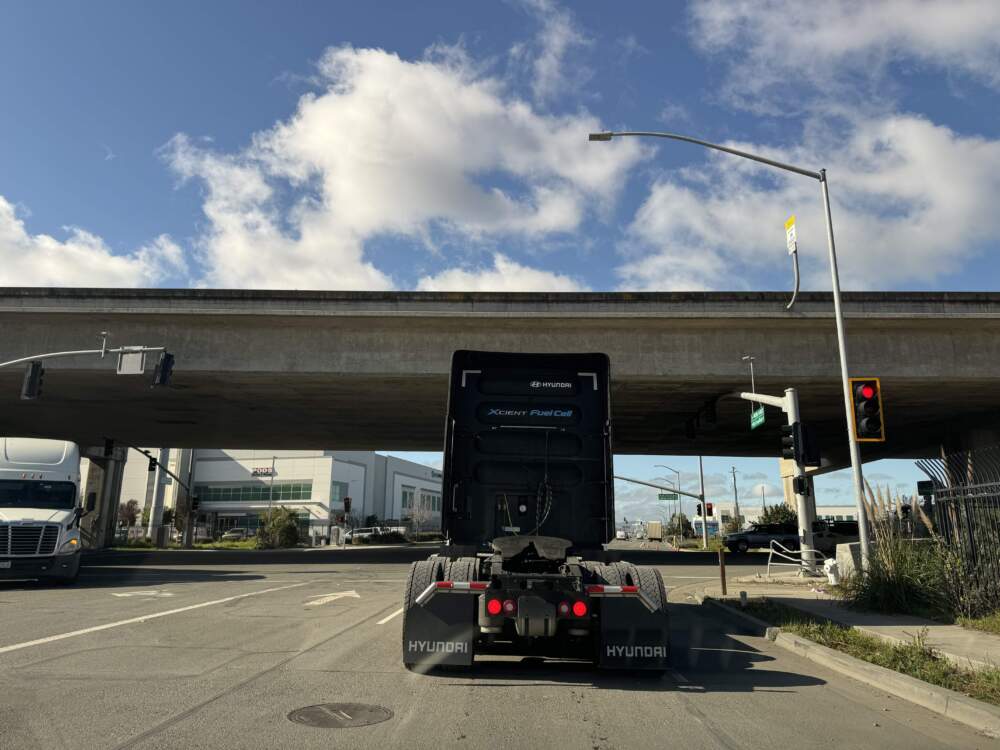 A hydrogen fuel-cell truck leaving the Port of Oakland. (Chris Bentley/Here & Now)Trucks move nearly three quarters of the nation's freight by weight. Since most of them burn diesel to do so, the industry is responsible for roughly a quarter of all American greenhouse gas emissions in the transportation sector.