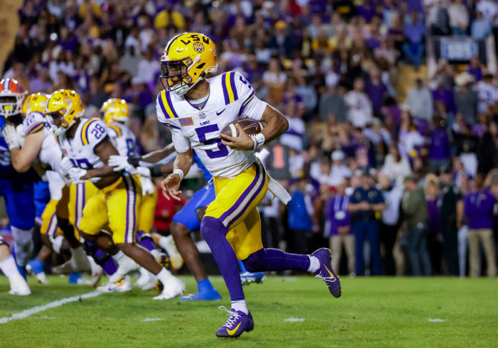 LSU quarterback Jayden Daniels (5) runs for a touchdown against Florida during the first half of an NCAA college football game in Baton Rouge, La. (Derick Hingle/AP)