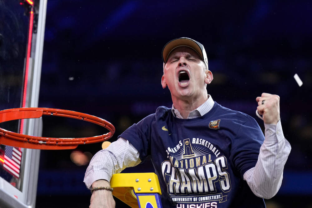 UConn head coach Dan Hurley celebrates cutting the net after the NCAA college Final Four championship basketball game against Purdue. (Brynn Anderson/AP)