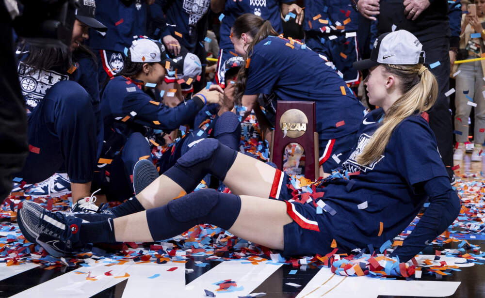 UConn guard Paige Bueckers, right, celebrates after a win over Southern California in an Elite Eight college basketball game in Portland, Ore. Howard Lao/AP)