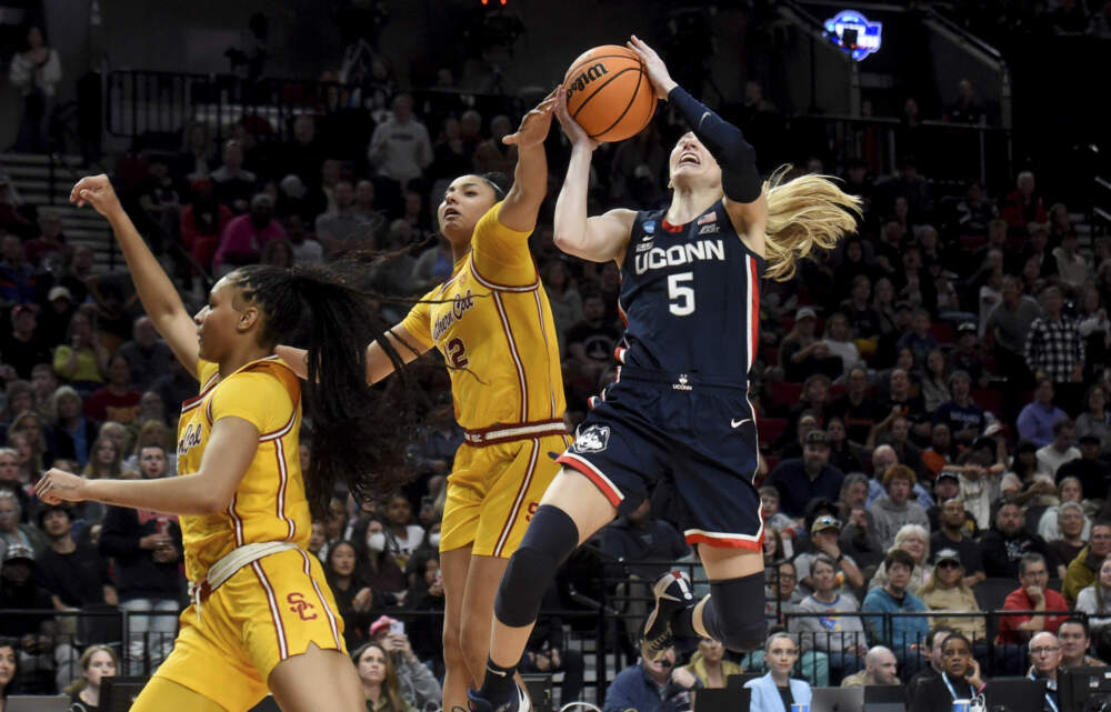 UConn guard Paige Bueckers, right, drives to the basket against Southern California guard JuJu Watkins. (Steve Dykes/AP)