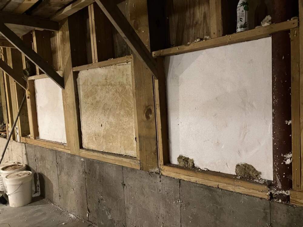 Three windows in Kent Hicks' basement in West Chesterfield, Massachusetts are designed to open in a flood, with the goal of allowing water to enter the house — and then rise and fall with the floodwaters outside. (Nancy Eve Cohen/NEPM)