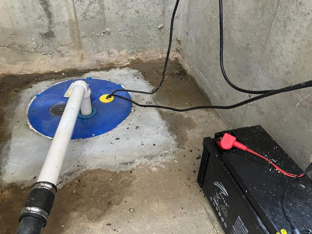 Sump pumps with a backup battery in the home of Mike Davis in Florence, Massachusetts. The battery backup is designed to keep the sump pumps operating even when a storm knocks the power out.