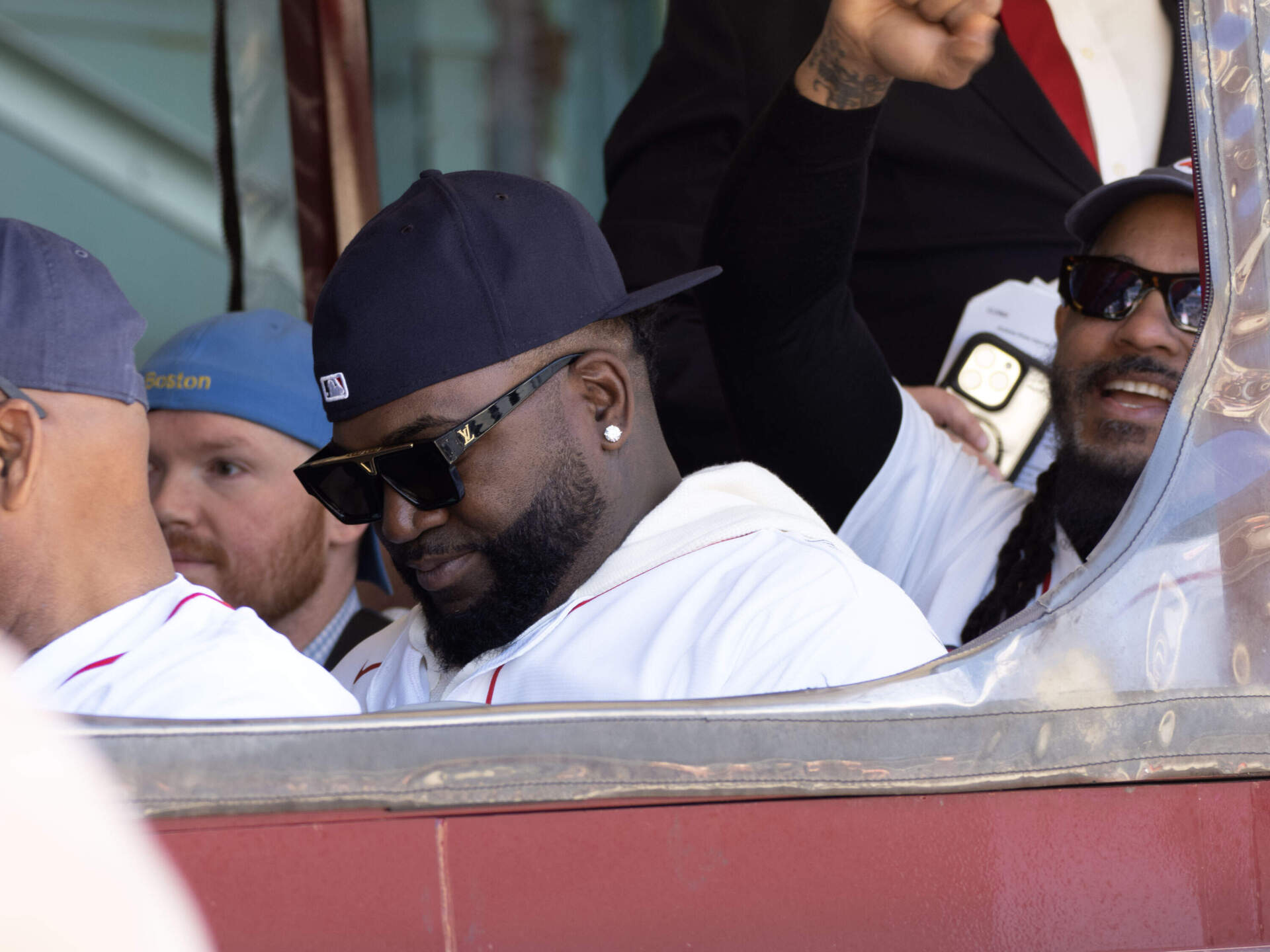David Ortiz and Manny Ramirez, right, were among the veterans of the 2004 Red Sox to arrive at Fenway Park in Duck Boats Tuesday afternoon. (Max Larkin/WBUR)