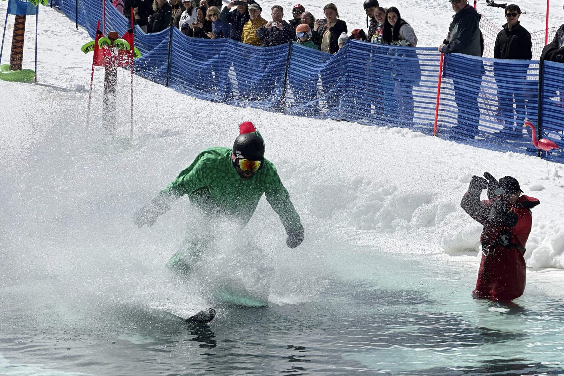 A costumed skier pond skims at Gunstock Mountain Resort, Sunday, April 7, 2024 (Nick Perry/AP)