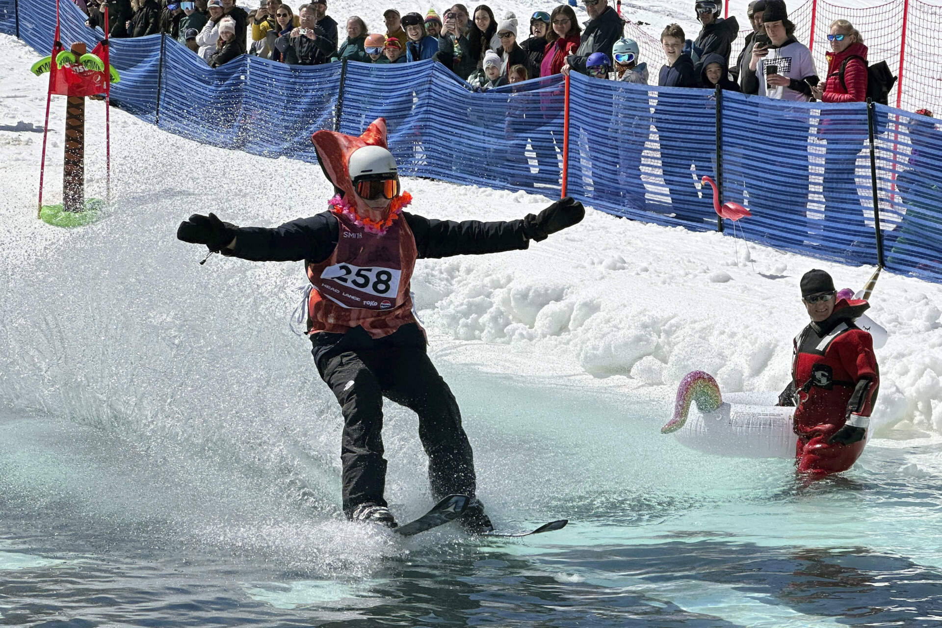 A skier participates in a pond skimming event in Gilford, N.H. (Nick Perry/AP)