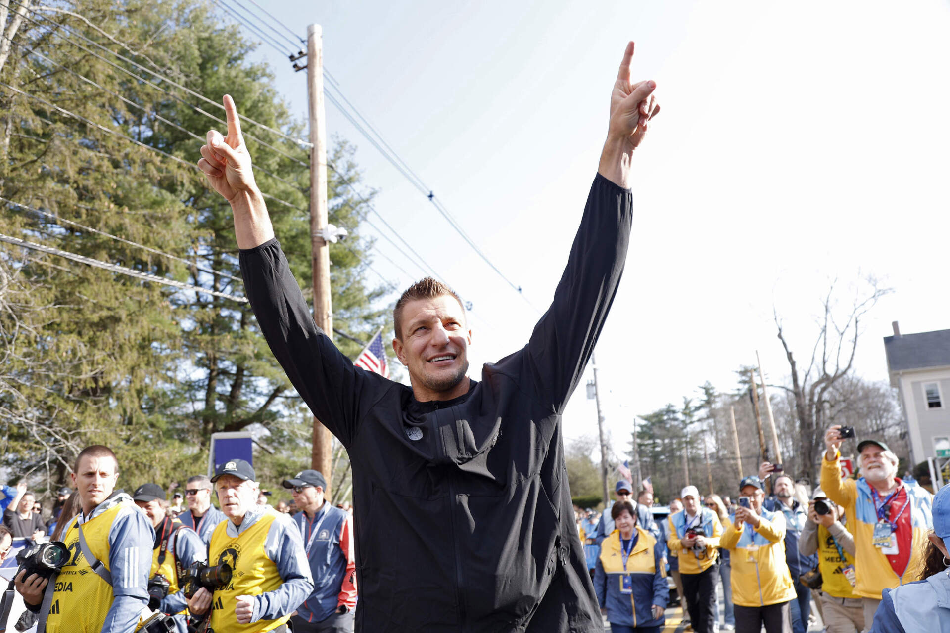 Grand Marshal and former New England Patriots NFL football player Rob Gronkowski interacts with the crowd at the start of the Boston Marathon in Hopkinton, Mass. (Mary Schwalm/AP)