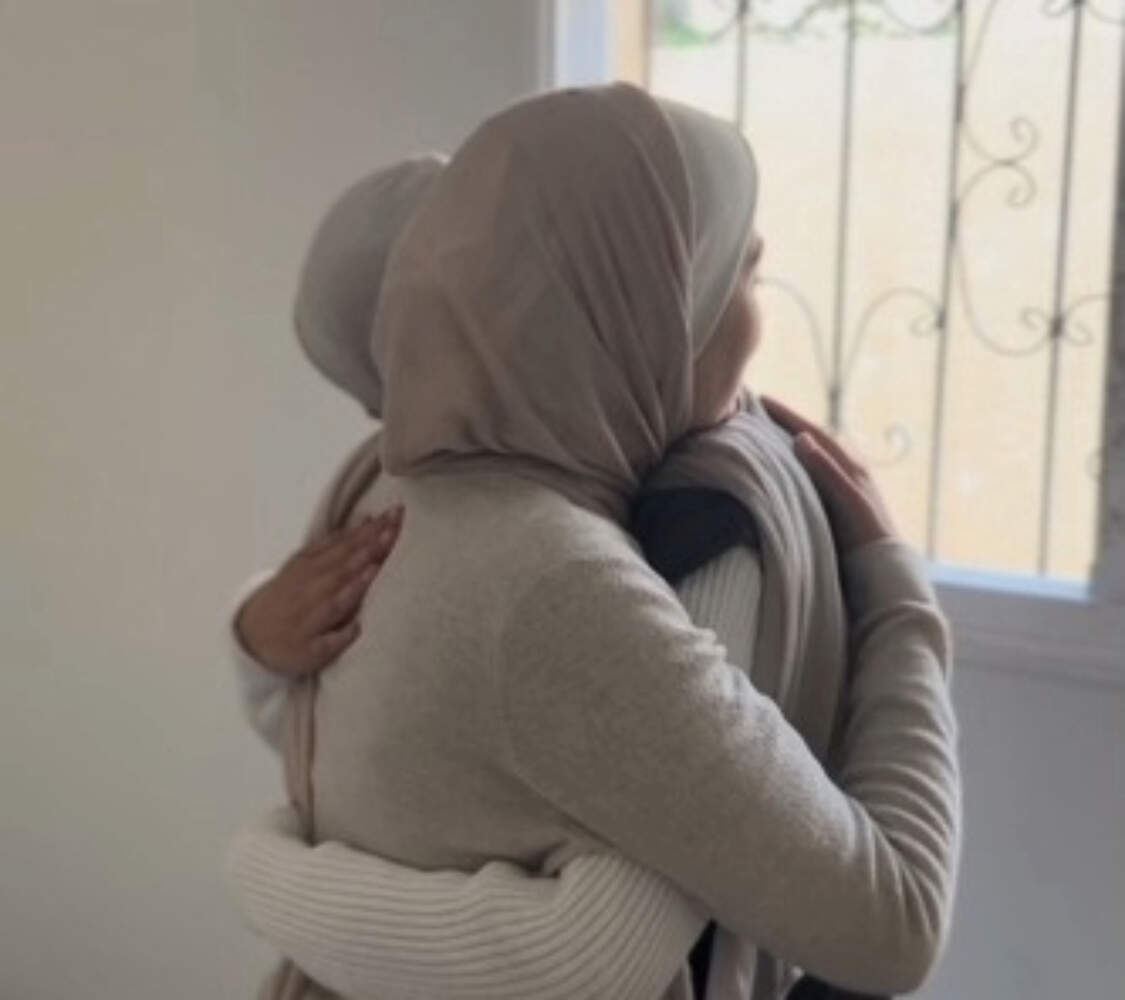 Nisreen Shehade hugging her sister goodbye the day she evacuated. (Courtesy of Nisreen Shehade)