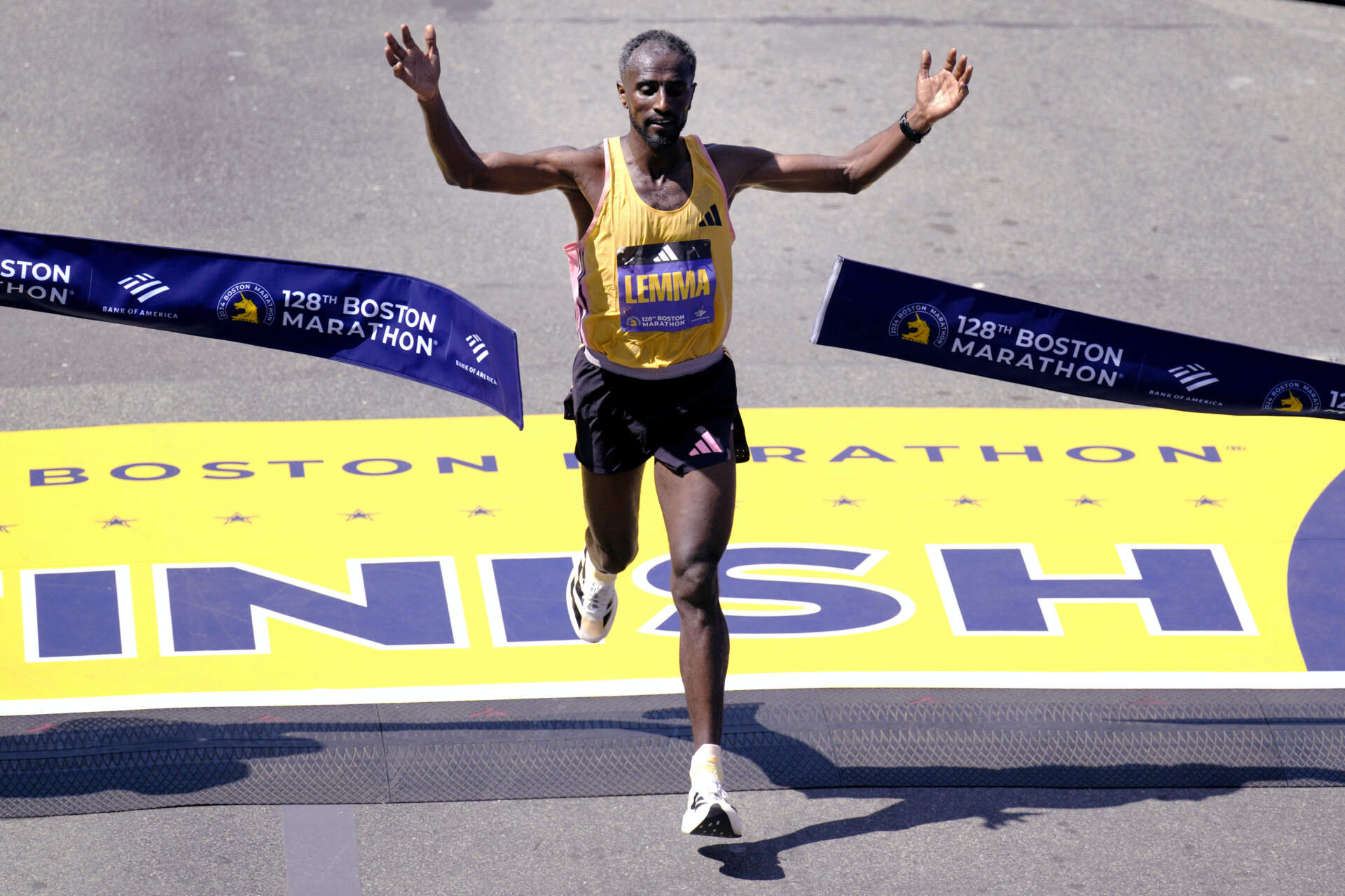 Sisay Lemma, of Ethiopia, breaks the tape to win the Boston Marathon. (Charles Krupa/AP)