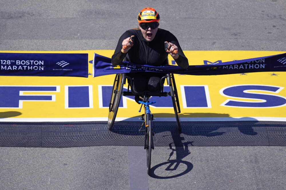Eden Rainbow Cooper, of Britain, breaks the tape to win the women's wheelchair division at the Boston Marathon. (Charles Krupa/AP)