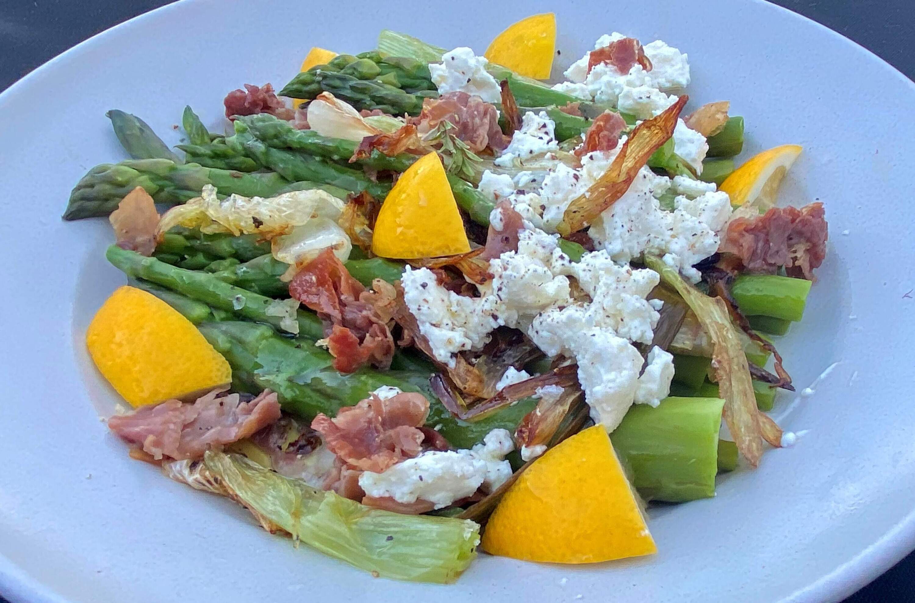 Asparagus, fried scallion, prosciutto and feta salad. (Kathy Gunst/Here &amp; Now)