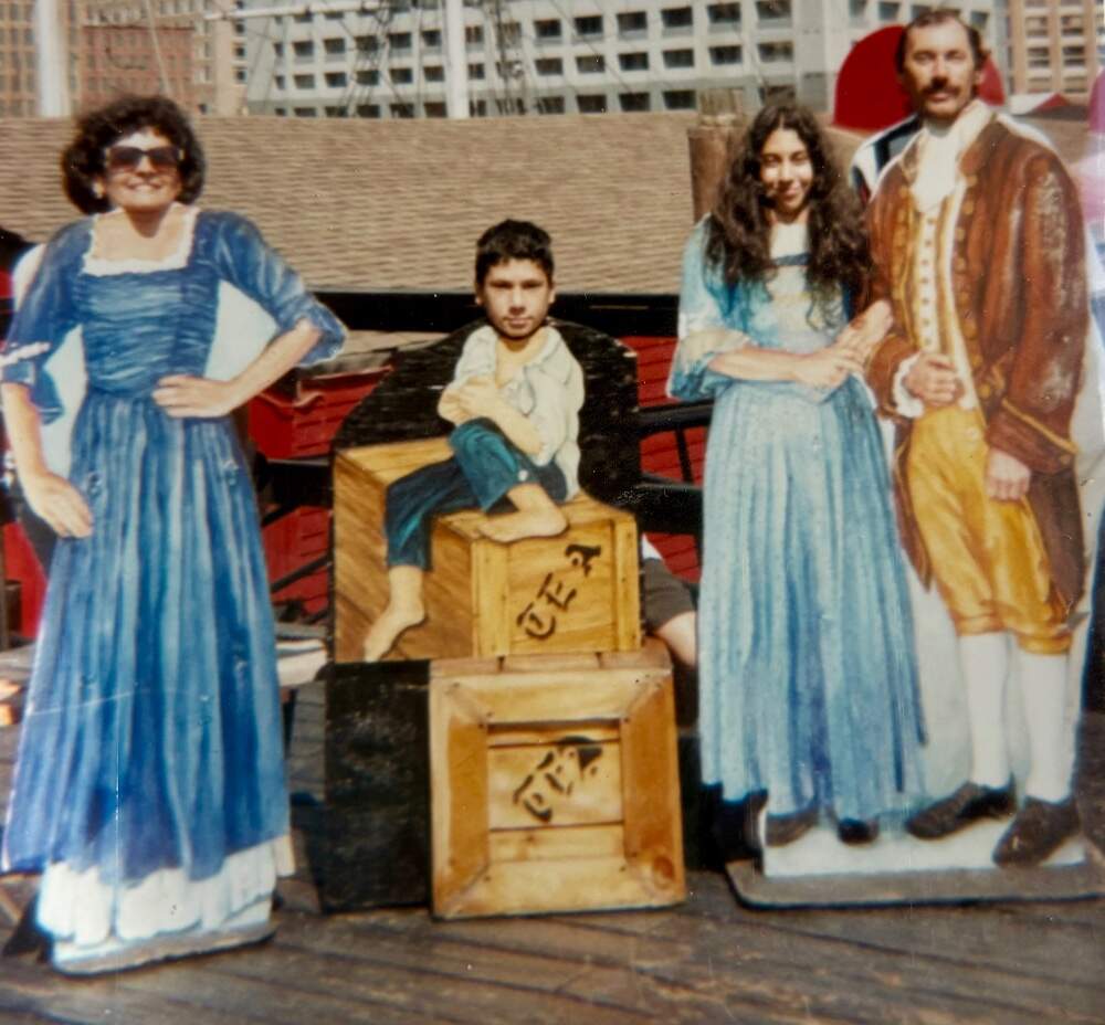 The author and her family at a photo stand, at the original Boston Tea Party Museum. (Courtesy Viktoria Shulevich)