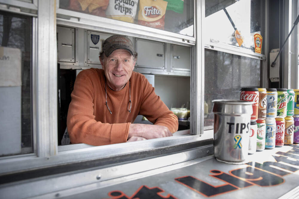 Mike "Murph" Murphy in his hot dog trailer in Lancaster, Mass. (Robin Lubbock/WBUR)