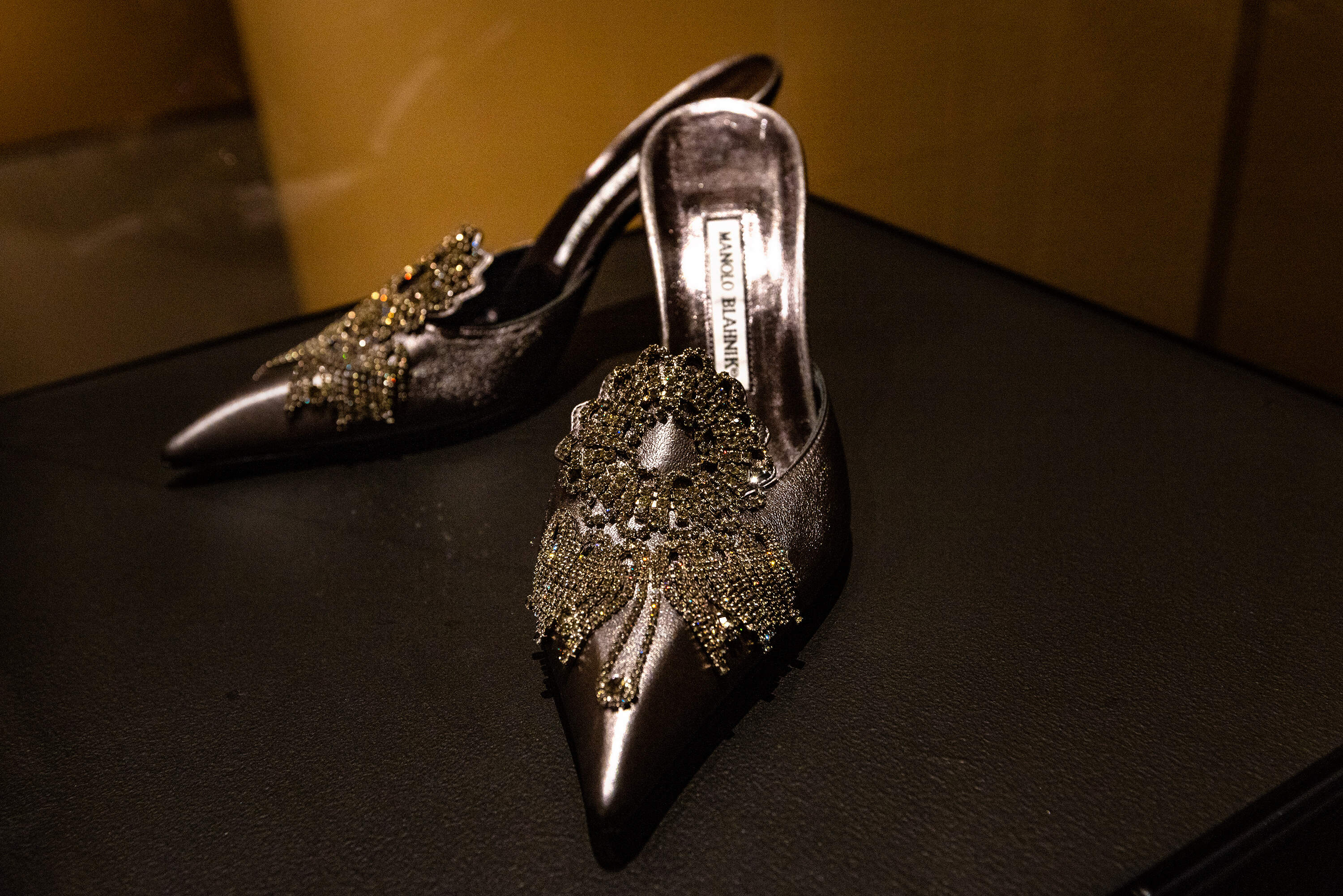 Leather shoes designed by Manolo Blahnik in 2006 worn by Donna Summer are part of the collection of works in the “Dress Up exhibit at the Museum of Fine Arts, Boston. (Jesse Costa/WBUR)