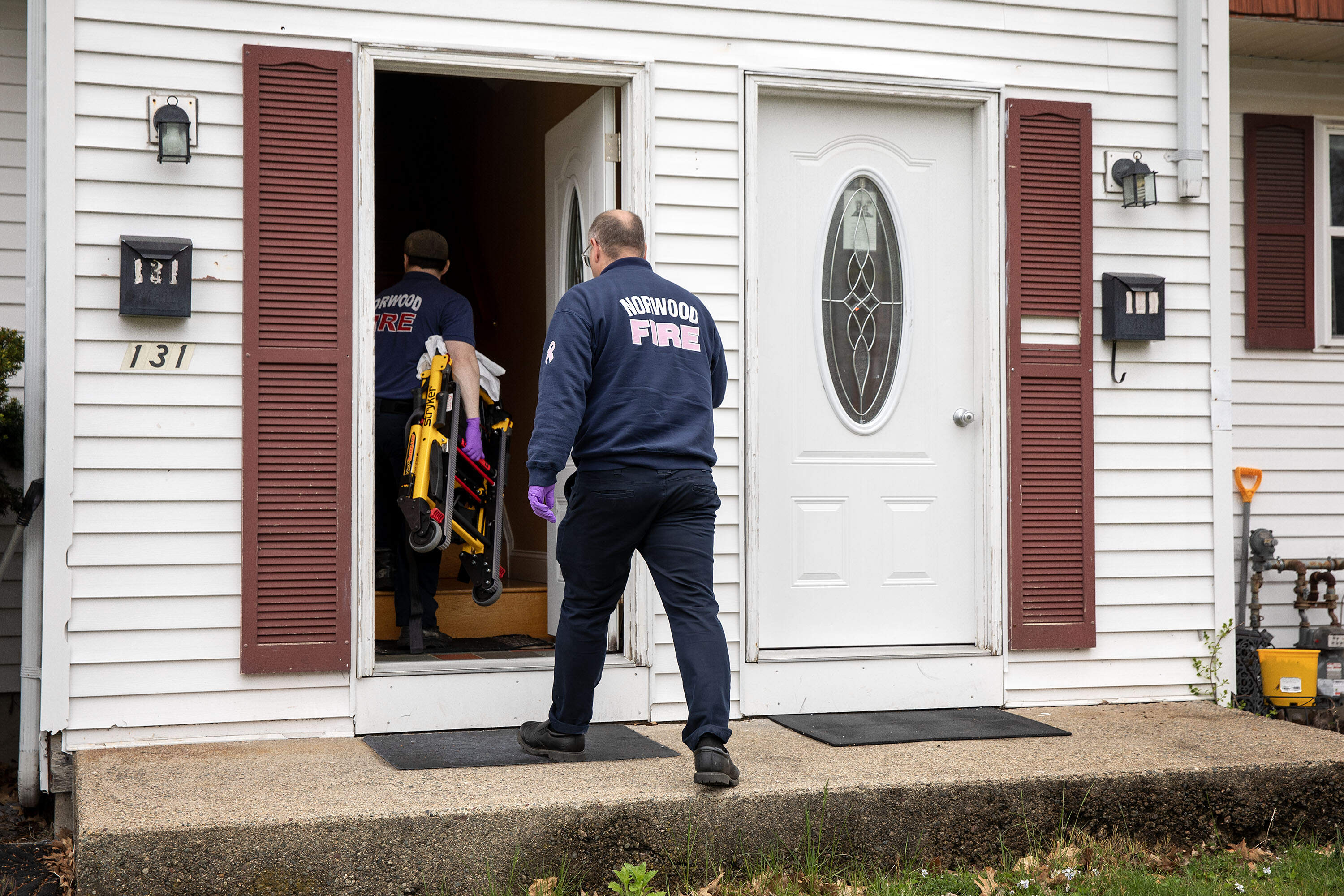 Norwood Fire paramedics respond to a medical emergency at a home. (Robin Lubbock/WBUR)