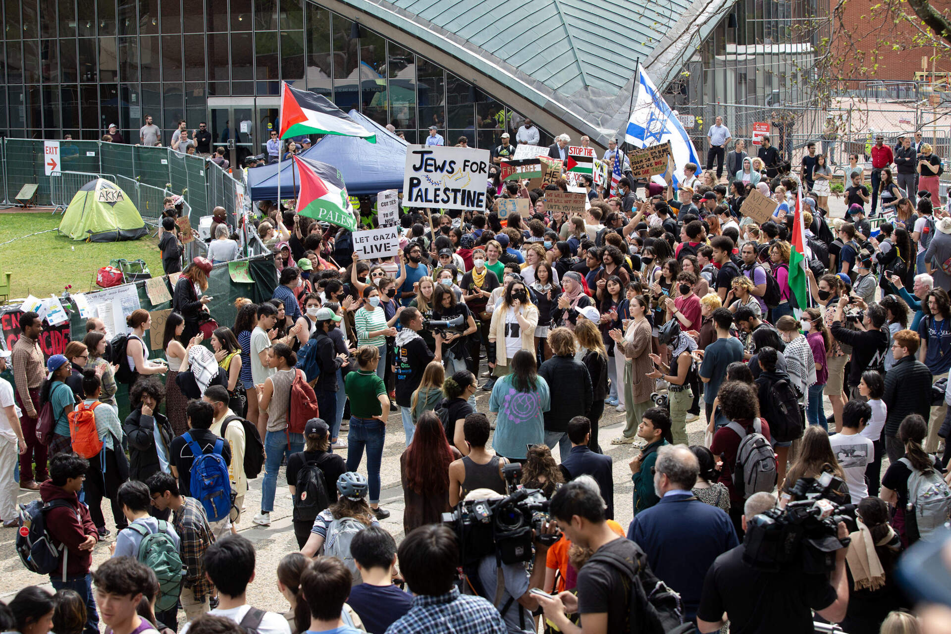 MIT students protesting the war in Gaza gather outside the encampment on Monday afternoon. (Robin Lubbock/WBUR)