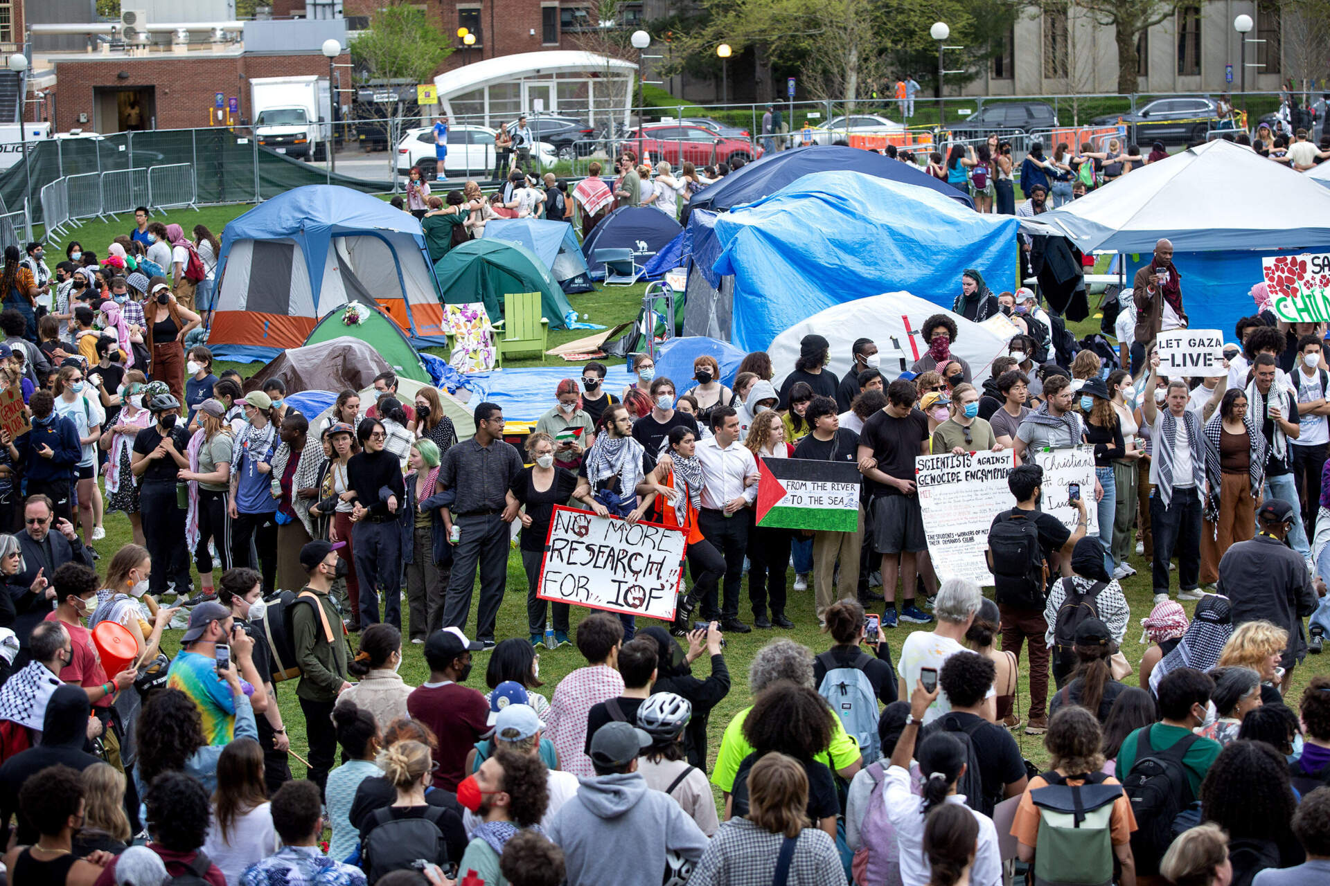 Protesters at MIT re-claim the encampment space on Kresge Lawn Monday evening, despite the university's threat of suspension. (Robin Lubbock/WBUR)