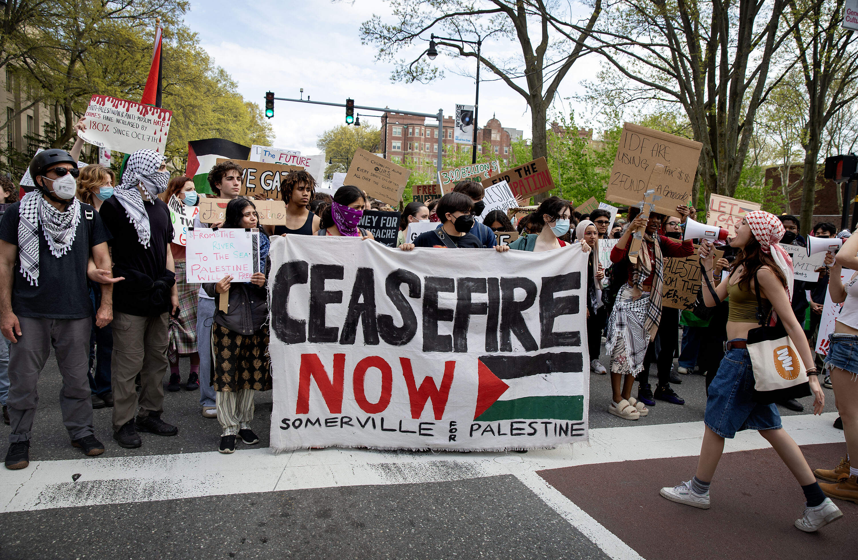 A group of students, including students from local high schools, blocked Massachusetts Avenue outside of MIT on Monday evening. (Robin Lubbock/WBUR)