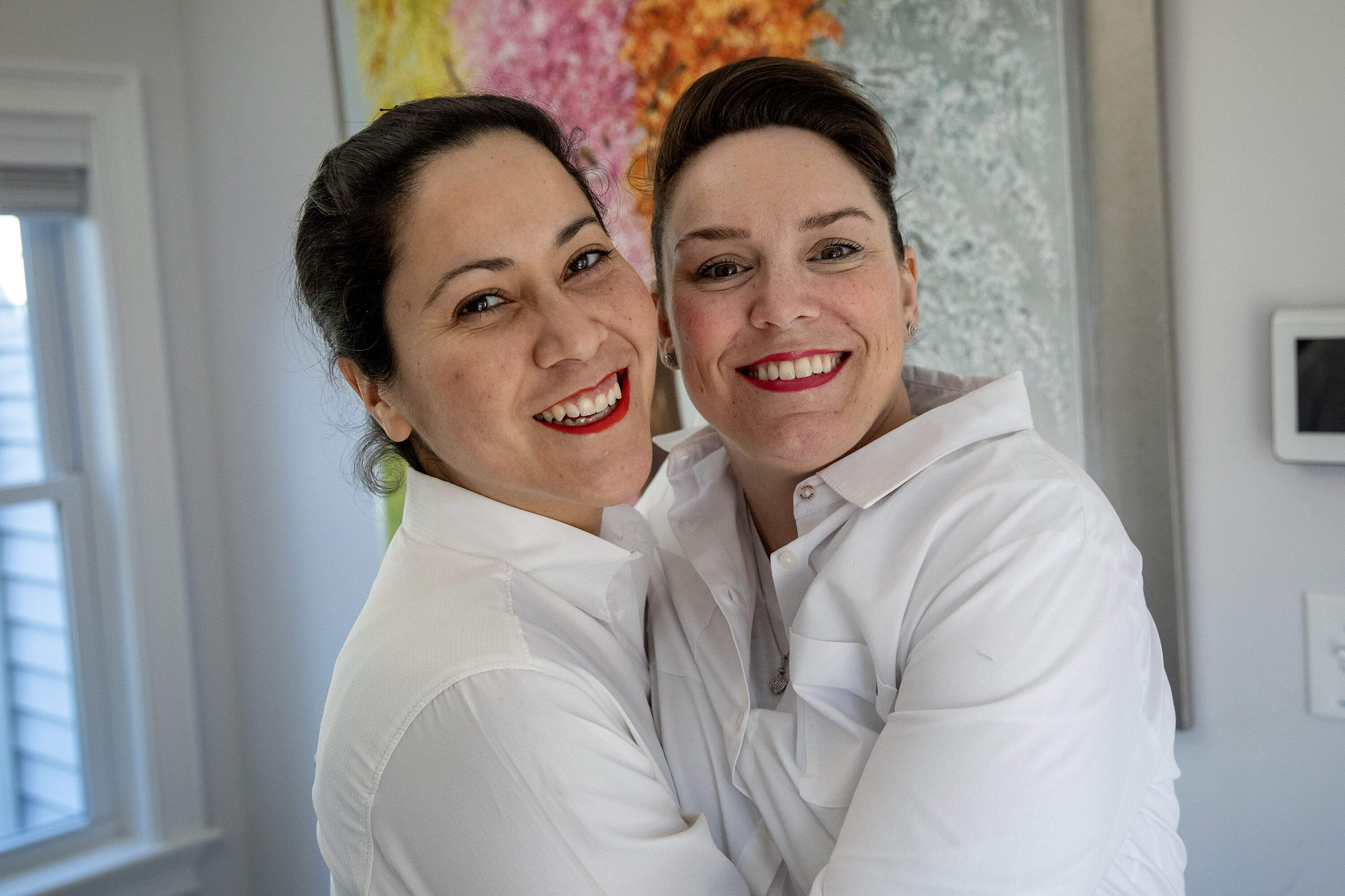 Gaby Leal and Chelsea Wood at their home in Danvers. (Robin Lubbock/WBUR)
