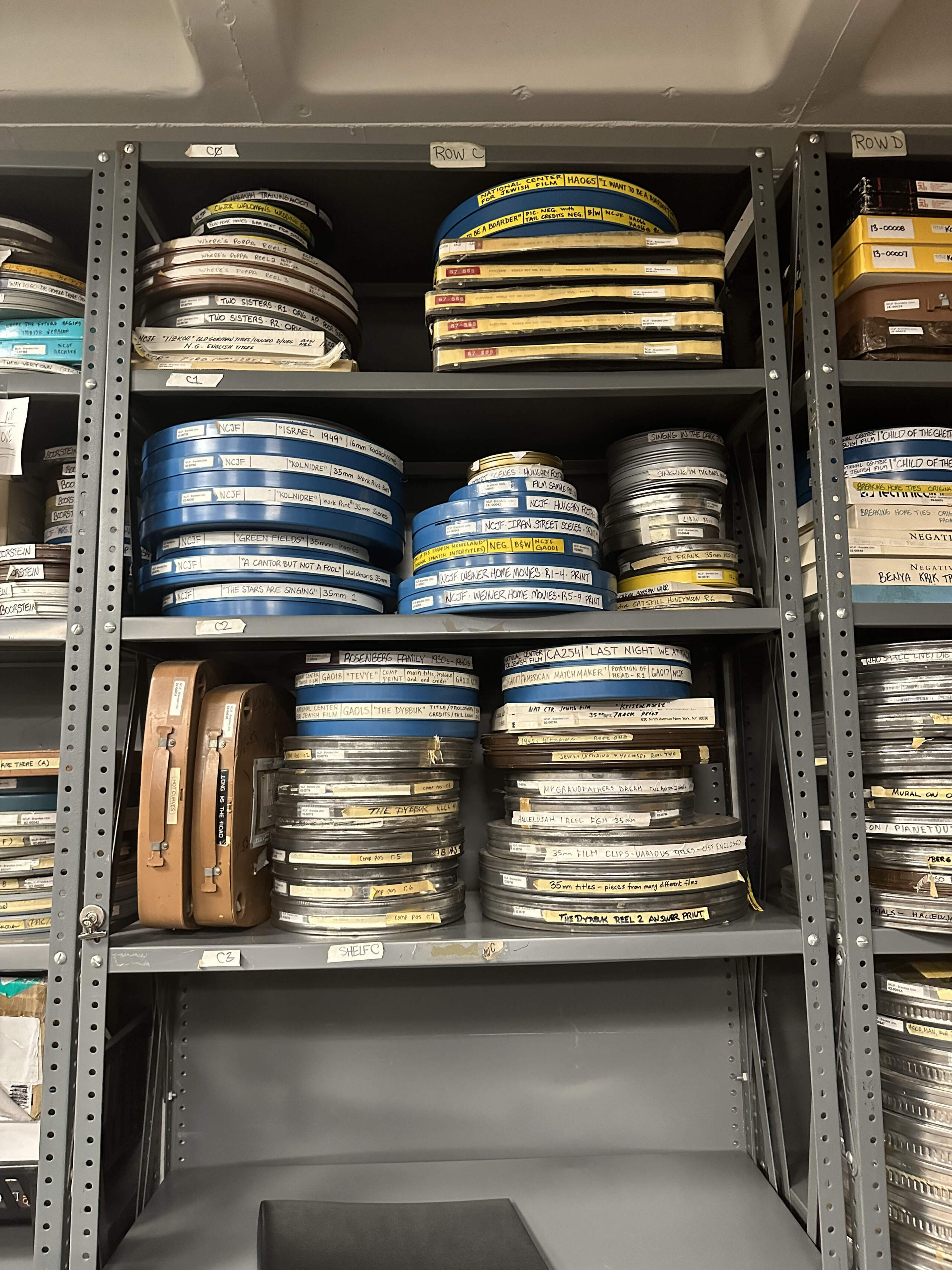 Reels on shelves at the National Center for Jewish Film. (Erin Trahan for WBUR)